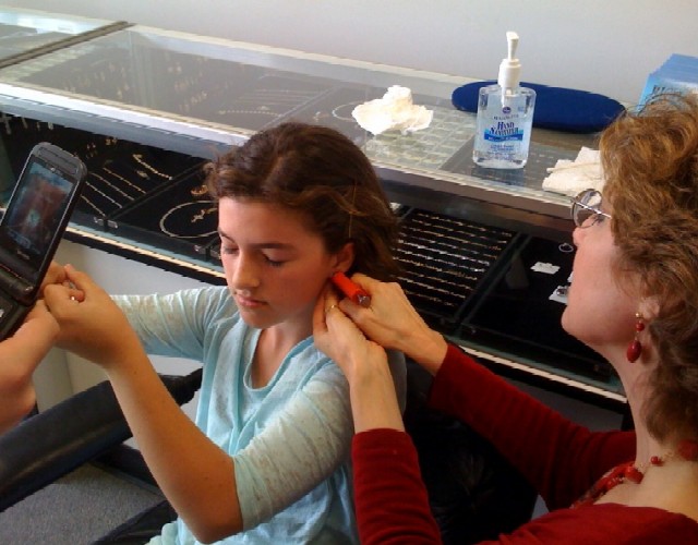 Janet piercing ears at Rothsteins of Beverly Hills